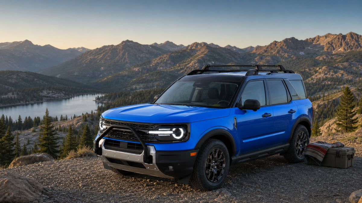Blue Ford Bronco Sport with Ventrickcar roof cross bars at a mountain overlook
